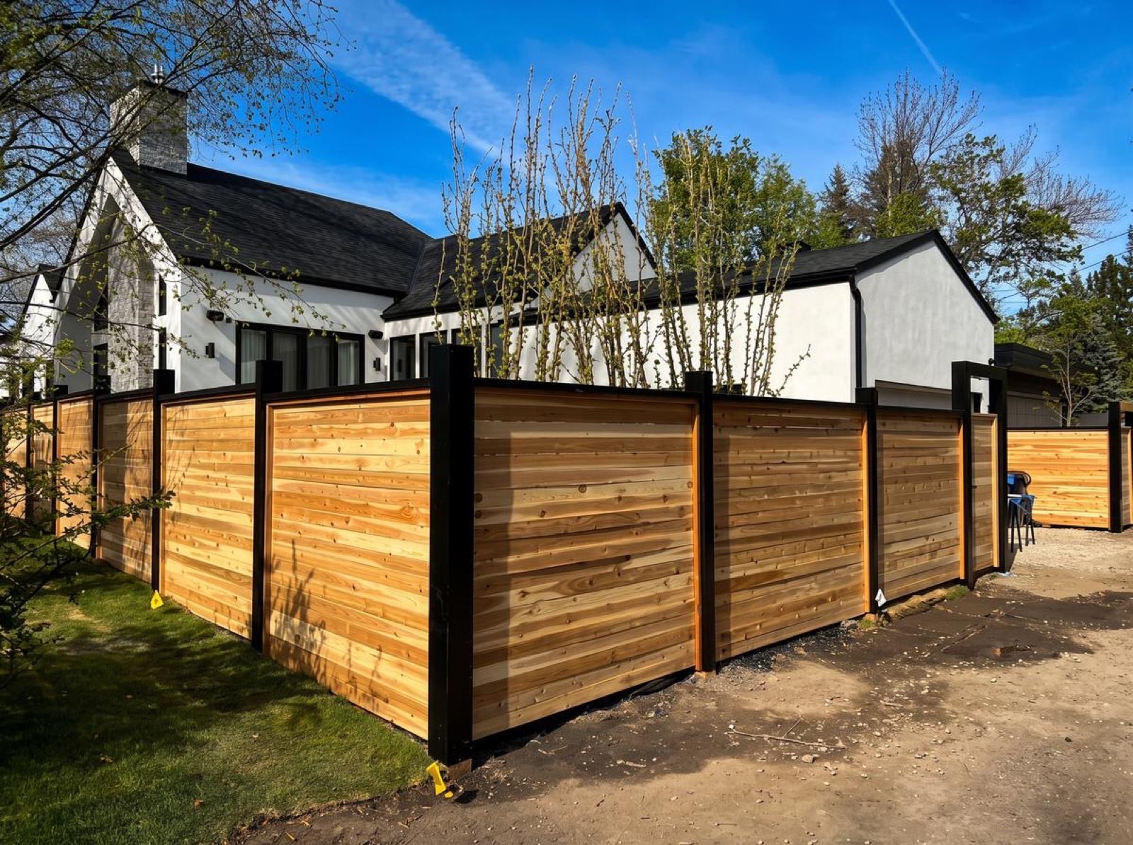 Cedar privacy fence, black posts