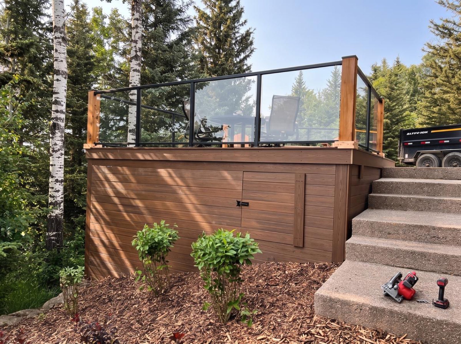 Composite deck with glass railing